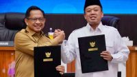 Menteri ATR/BPN Nusron Wahid dan Mendagri Tito Karnavian menandatangani kebijakan integrasi data NIB dan NOP PBB di Jakarta.